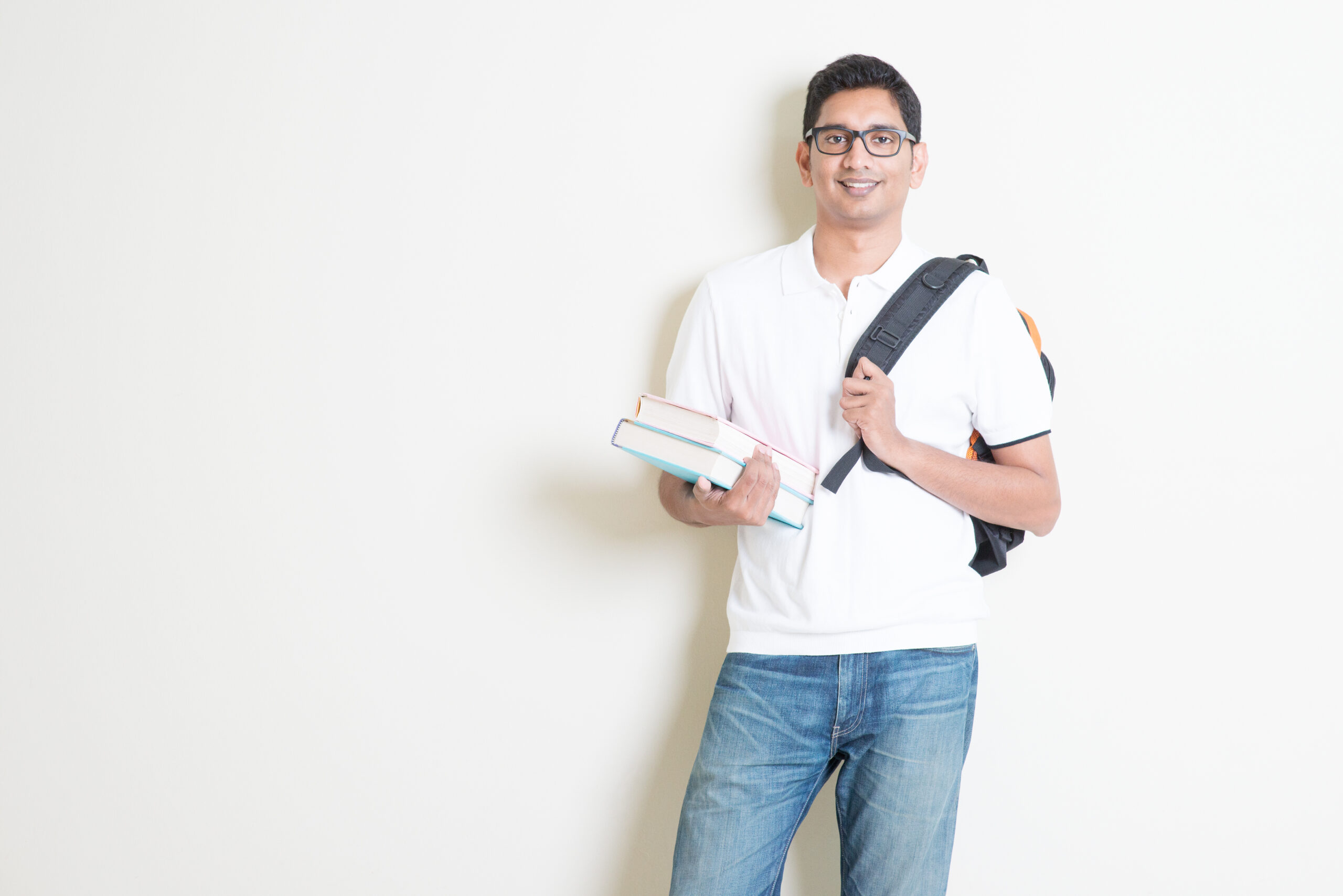 Portrait,Of,Adult,Indian,University,Student,With,Books,And,Bag.